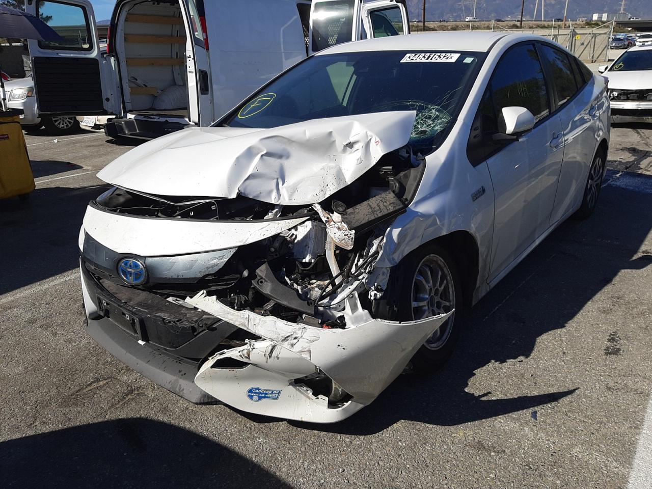Photo 2 from auction – 2021 TOYOTA PRIUS PRIM with VIN JTDKAMFP1M3168803