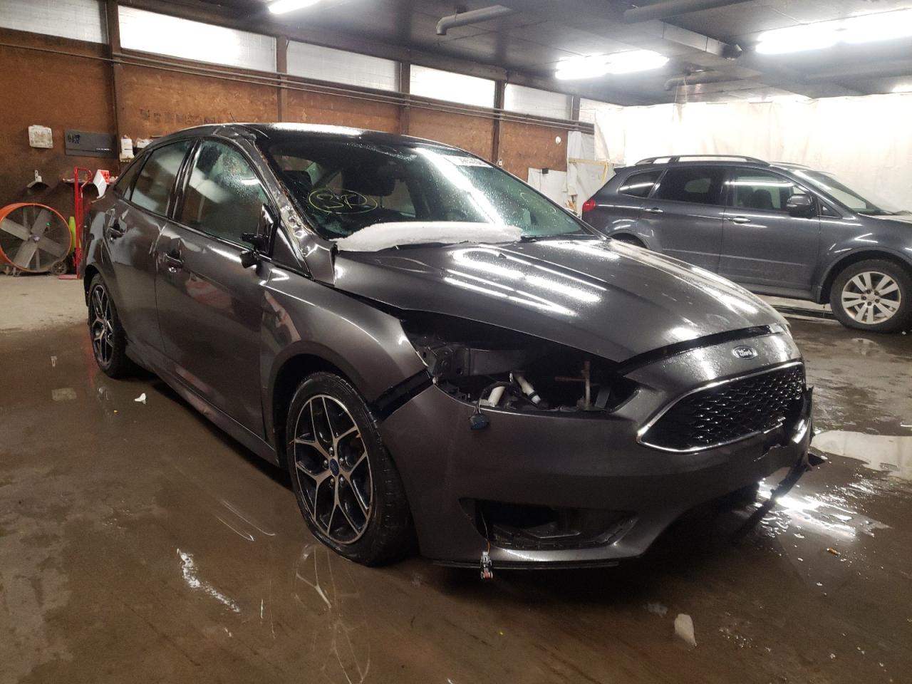 FORD FOCUS SE 2016 with VIN 1FADP3F21GL243225 - Photo from auction