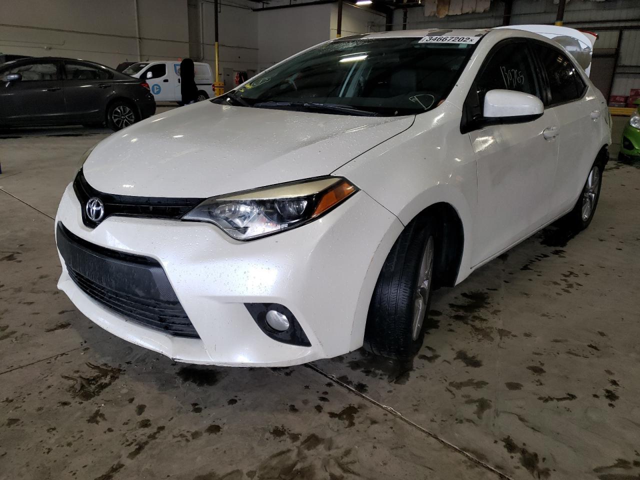 Photo 2 from auction – 2014 TOYOTA COROLLA EC with VIN 5YFBPRHE0EP077456