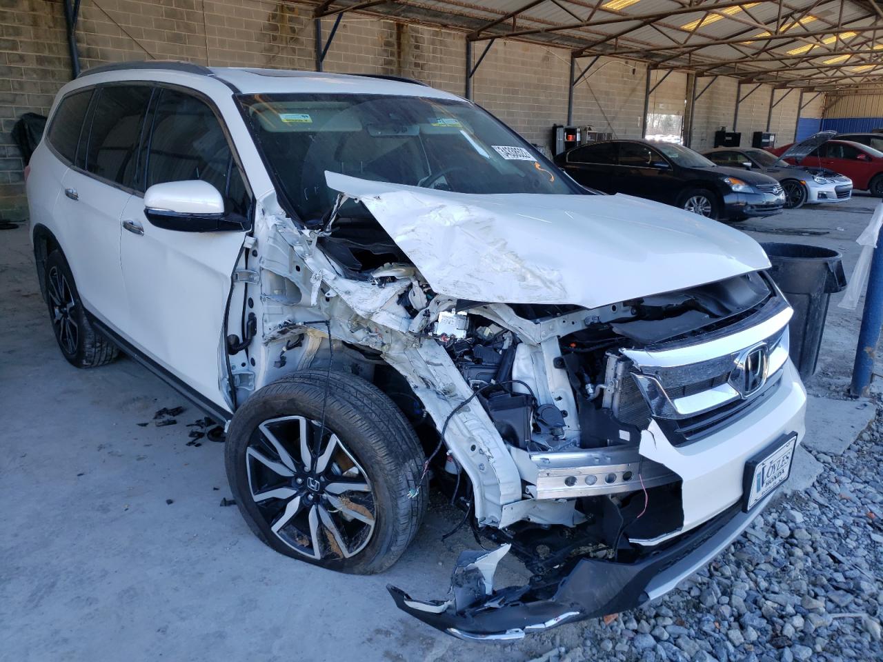 HONDA PILOT TOUR 2021 with VIN 5FNYF6H67MB042069 - Photo from auction