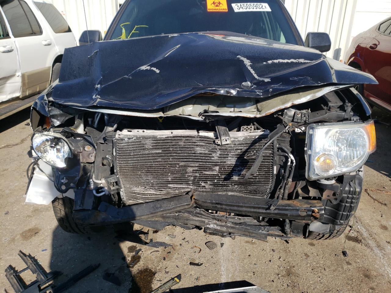 Photo 9 from auction – 2011 FORD ESCAPE LIM with VIN 1FMCU0E74BKC47290