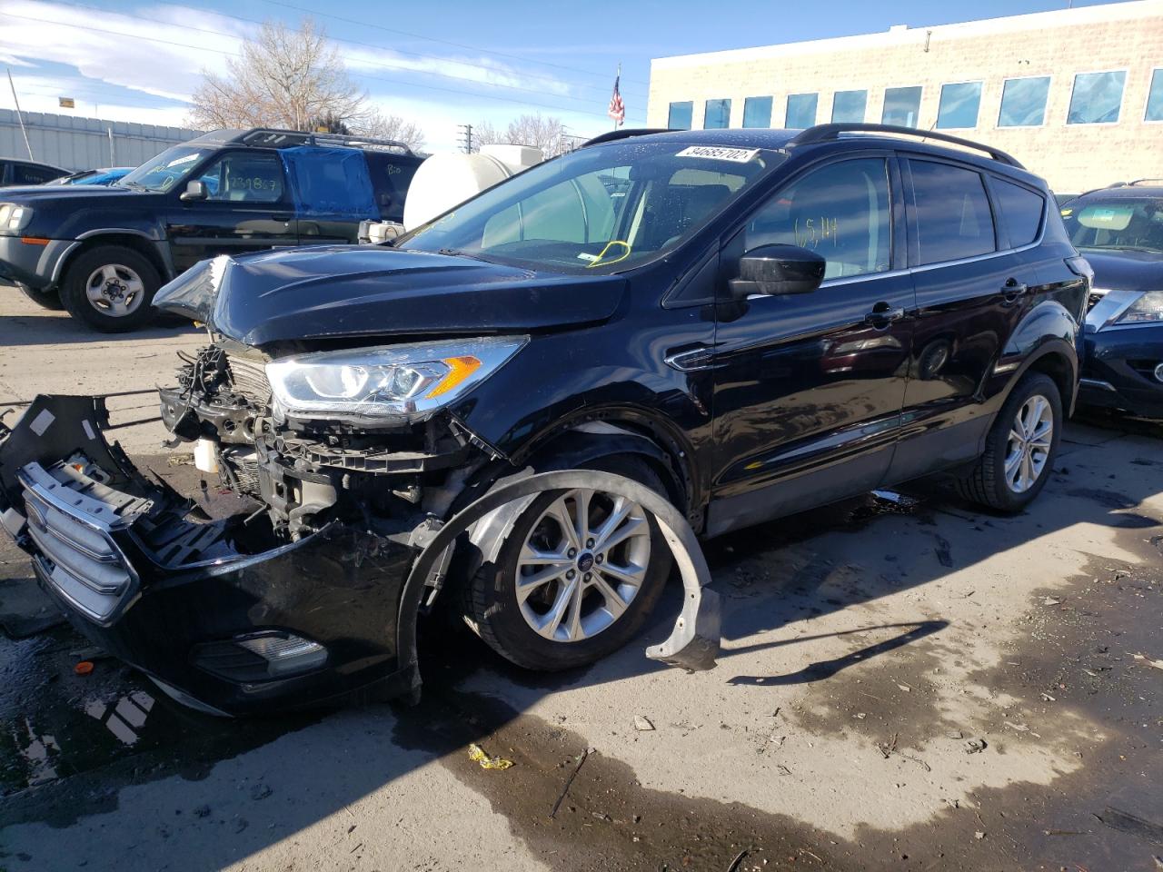 Photo 2 from auction – 2017 FORD ESCAPE SE with VIN 1FMCU9GD3HUD09363