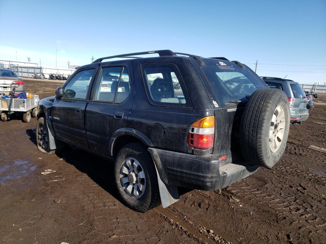 Photo 3 from auction – 1999 HONDA PASSPORT E with VIN 4S6CM58WXX4418272
