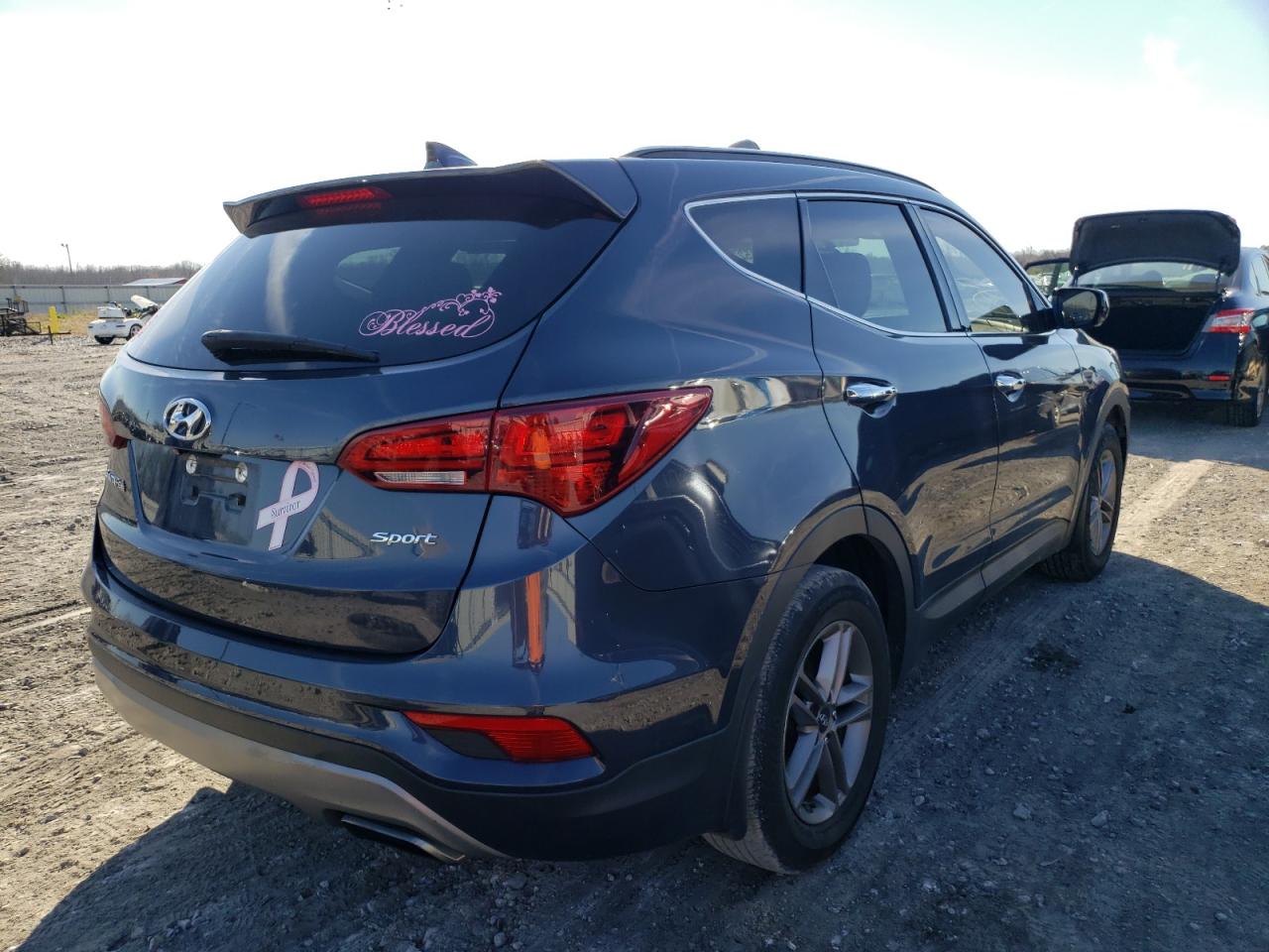 Photo 4 from auction – 2017 HYUNDAI SANTA FE with VIN 5NMZU3LB0HH019914