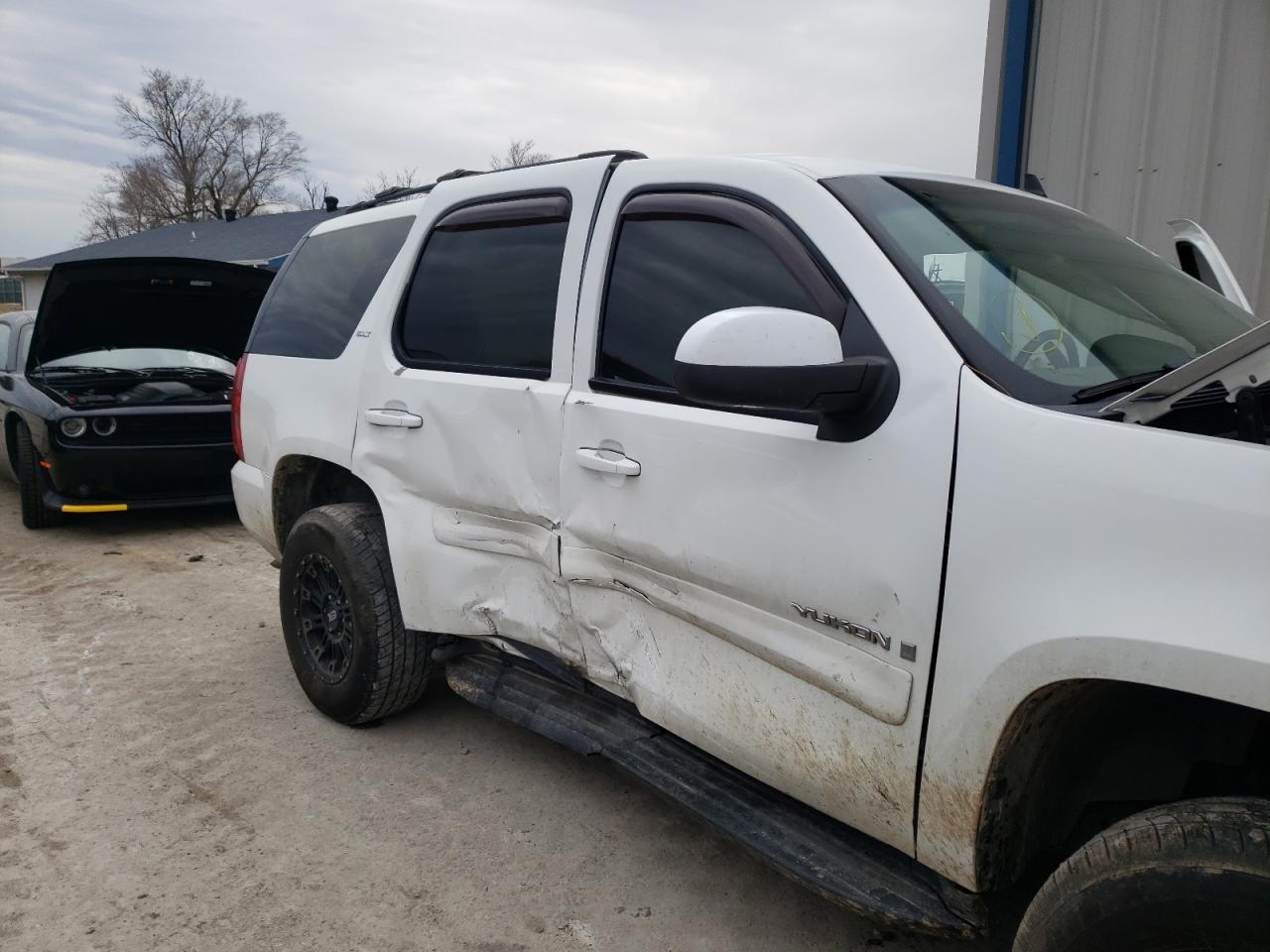Photo 9 from auction – 2007 GMC YUKON with VIN 1GKFK13057J116115