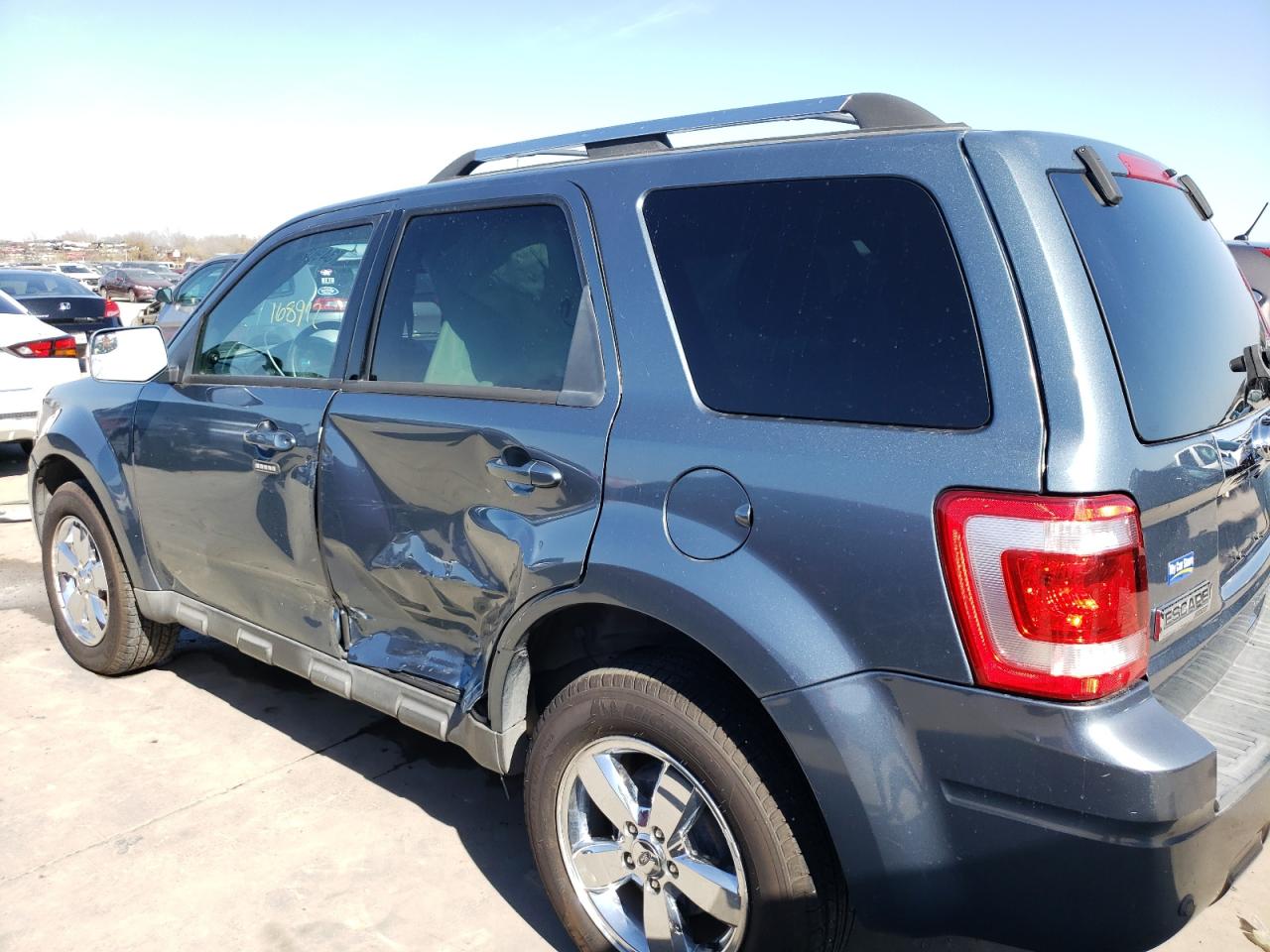 Photo 9 from auction – 2011 FORD ESCAPE LIM with VIN 1FMCU0EG5BKA27138