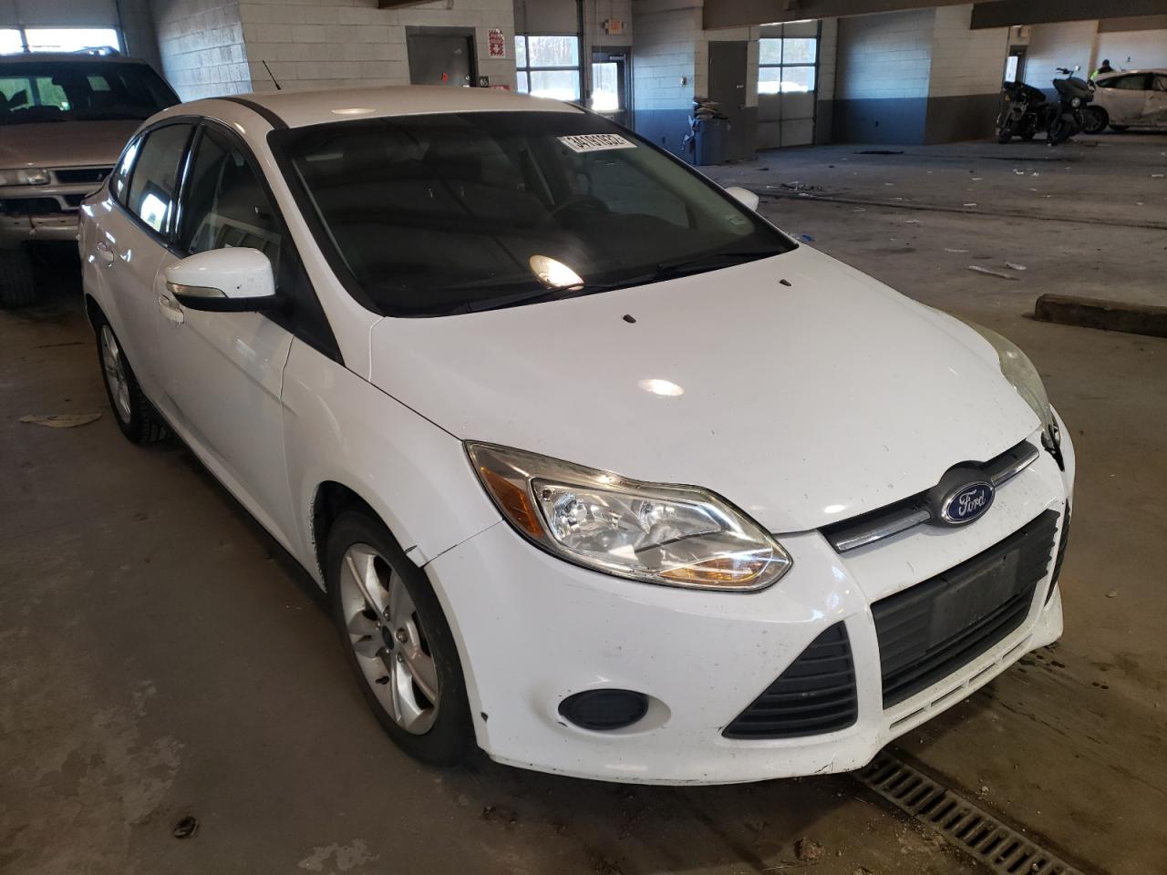 FORD FOCUS SE 2014 with VIN 1FADP3F26EL416718 - Photo from auction