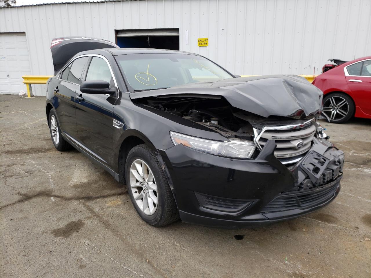 FORD TAURUS SE 2015 with VIN 1FAHP2D81FG124424 - Photo from auction