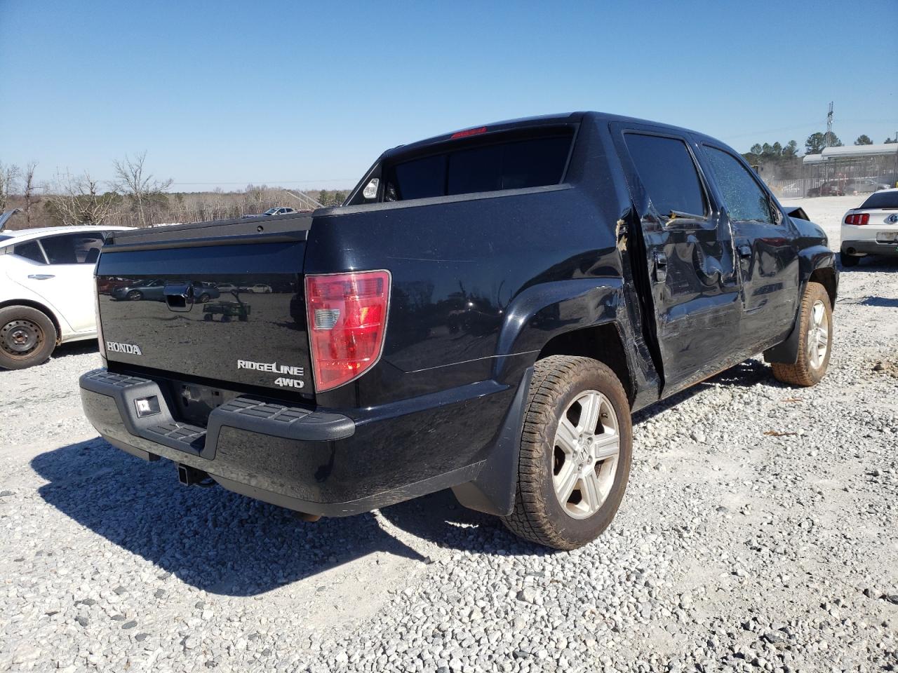 Photo 4 from auction – 2011 HONDA RIDGELINE with VIN 5FPYK1F5XBB451843