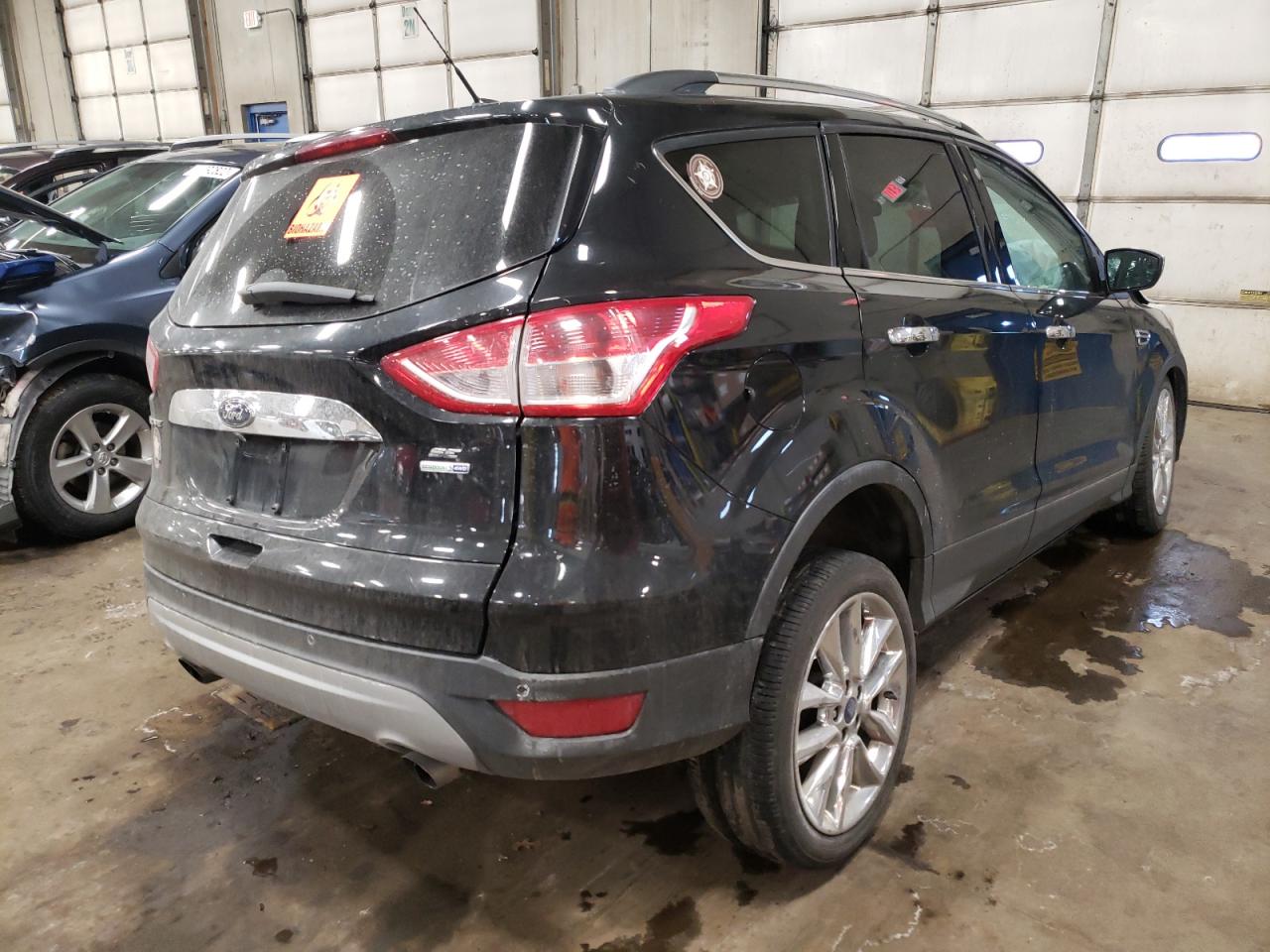 Photo 4 from auction – 2014 FORD ESCAPE SE with VIN 1FMCU9GX7EUD24972