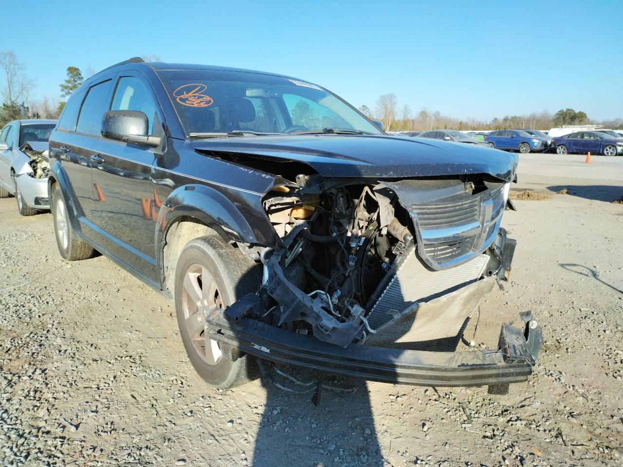 DODGE JOURNEY SX 2010 with VIN 3D4PG5FV9AT182122 - Photo from auction