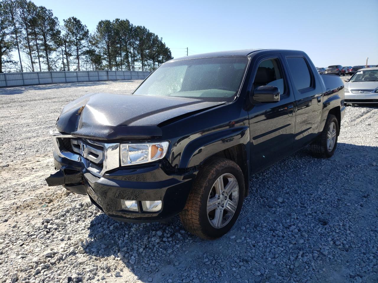 Photo 2 from auction – 2011 HONDA RIDGELINE with VIN 5FPYK1F5XBB451843