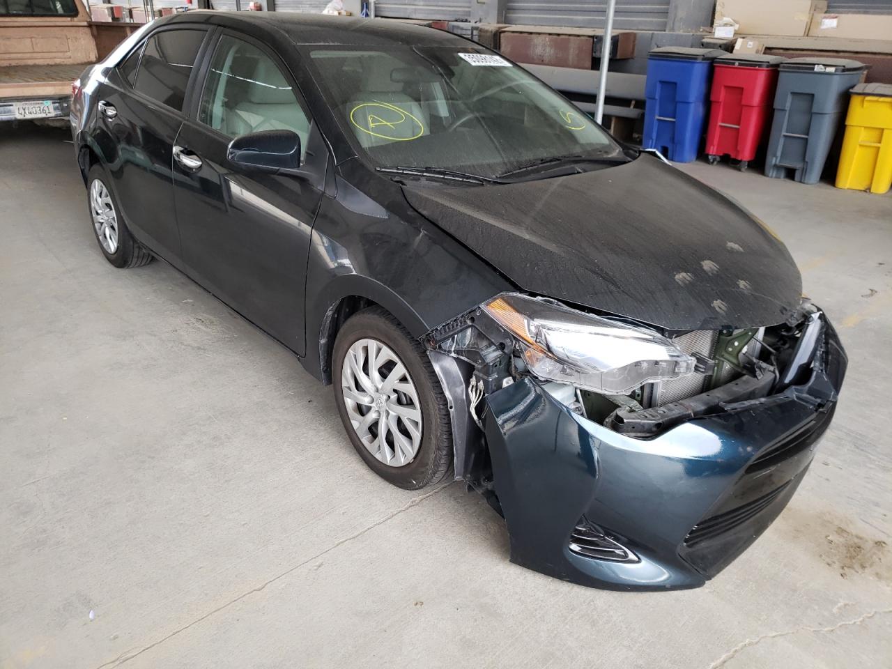 TOYOTA COROLLA L 2017 with VIN 5YFBURHE0HP697981 - Photo from auction