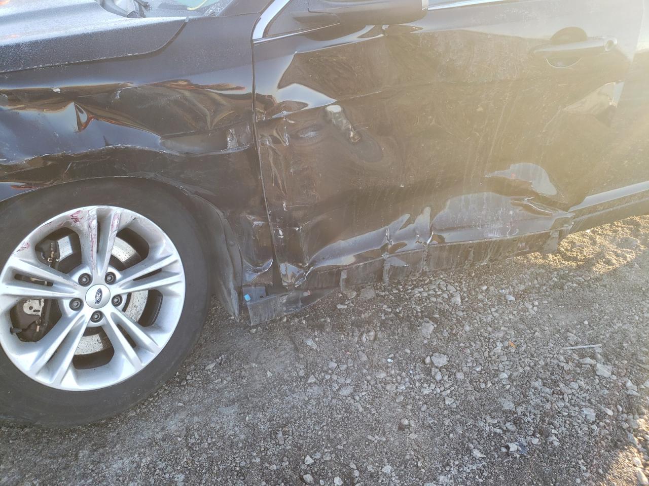 Photo 9 from auction – 2014 FORD TAURUS POL with VIN 1FAHP2MK4EG111791