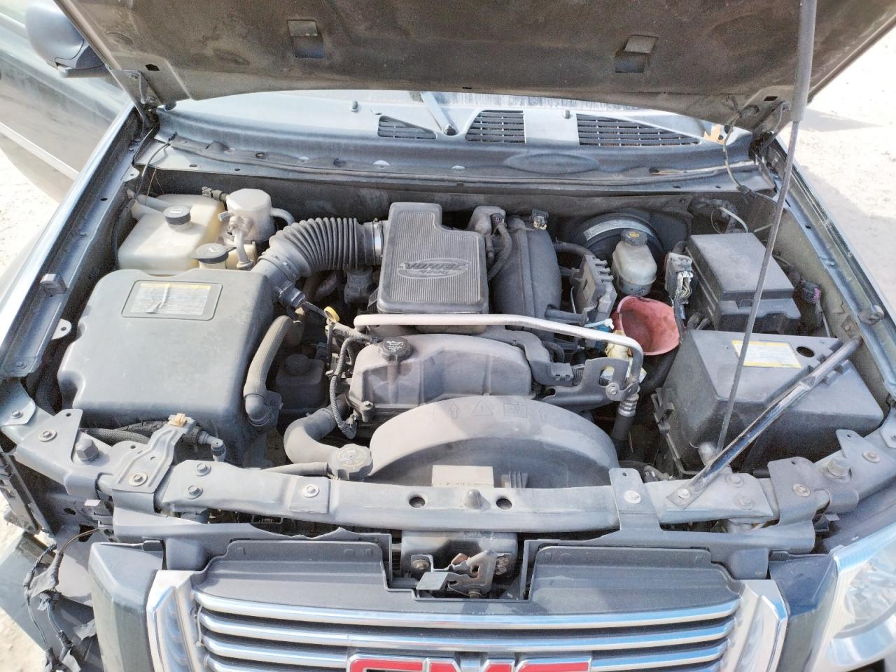 Photo 7 from auction – 2006 GMC ENVOY with VIN 1GKDS13SX62322077