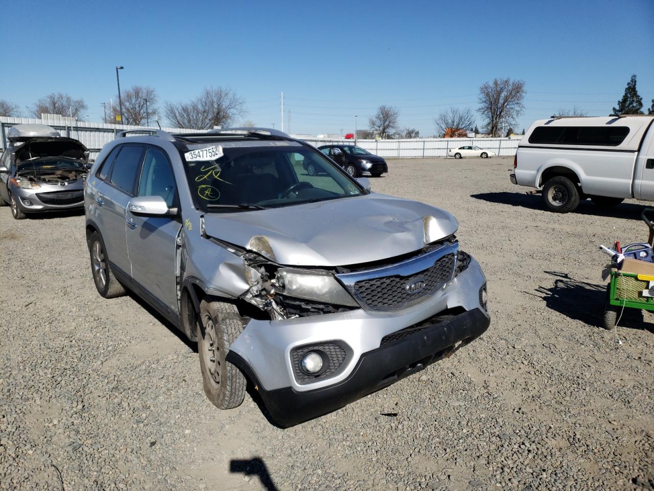 KIA SORENTO EX 2011 with VIN 5XYKUDA22BG044910 - Photo from auction