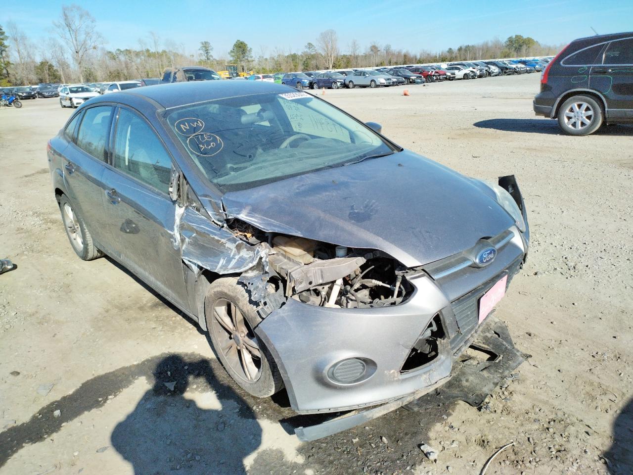 FORD FOCUS SE 2014 with VIN 1FADP3F20EL424894 - Photo from auction