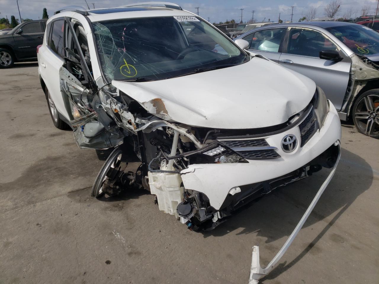 TOYOTA RAV4 XLE 2014 with VIN JTMWFREV9EJ015762 - Photo from auction