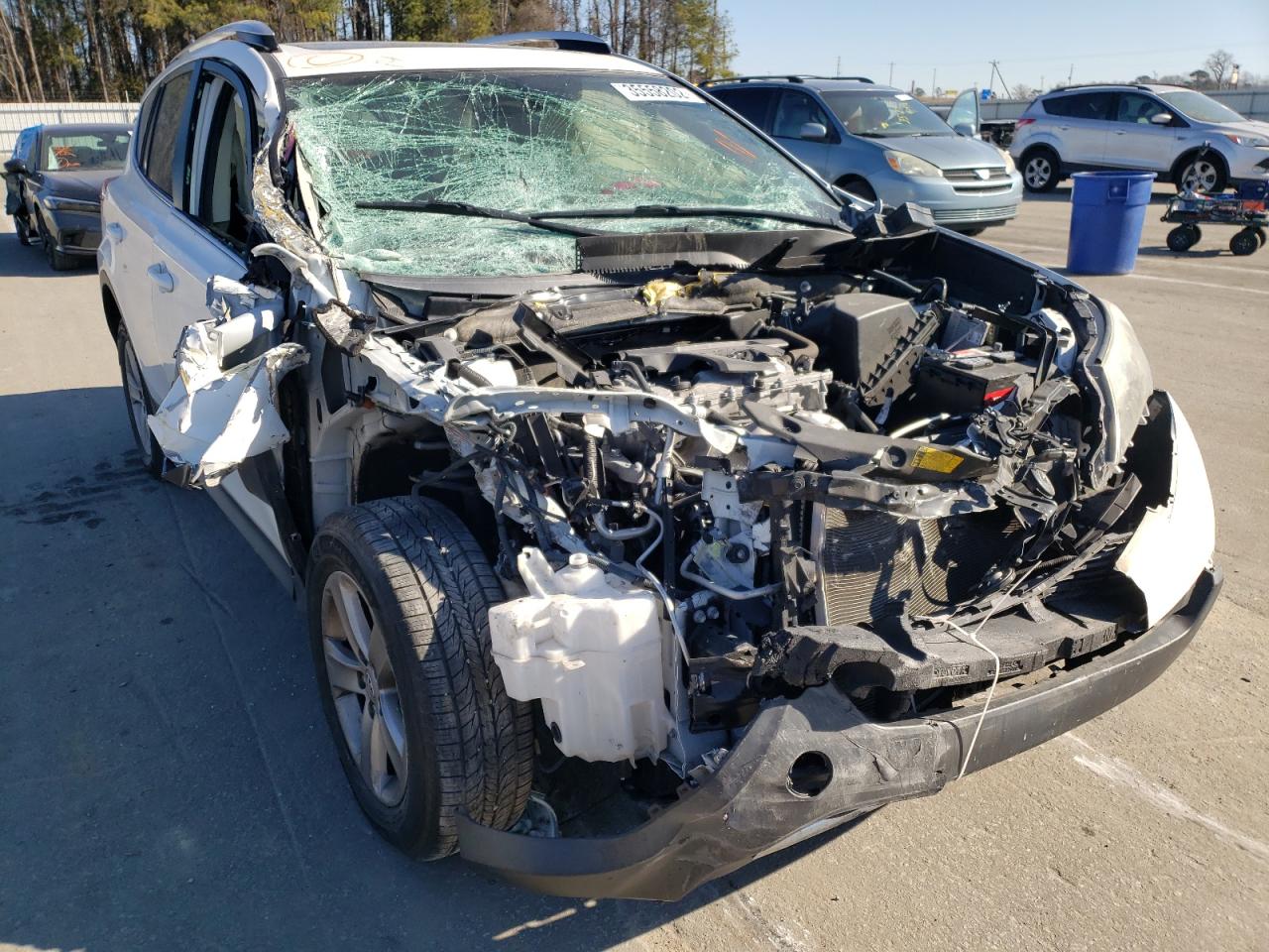 TOYOTA RAV4 XLE 2014 with VIN JTMWFREV2EJ009902 - Photo from auction
