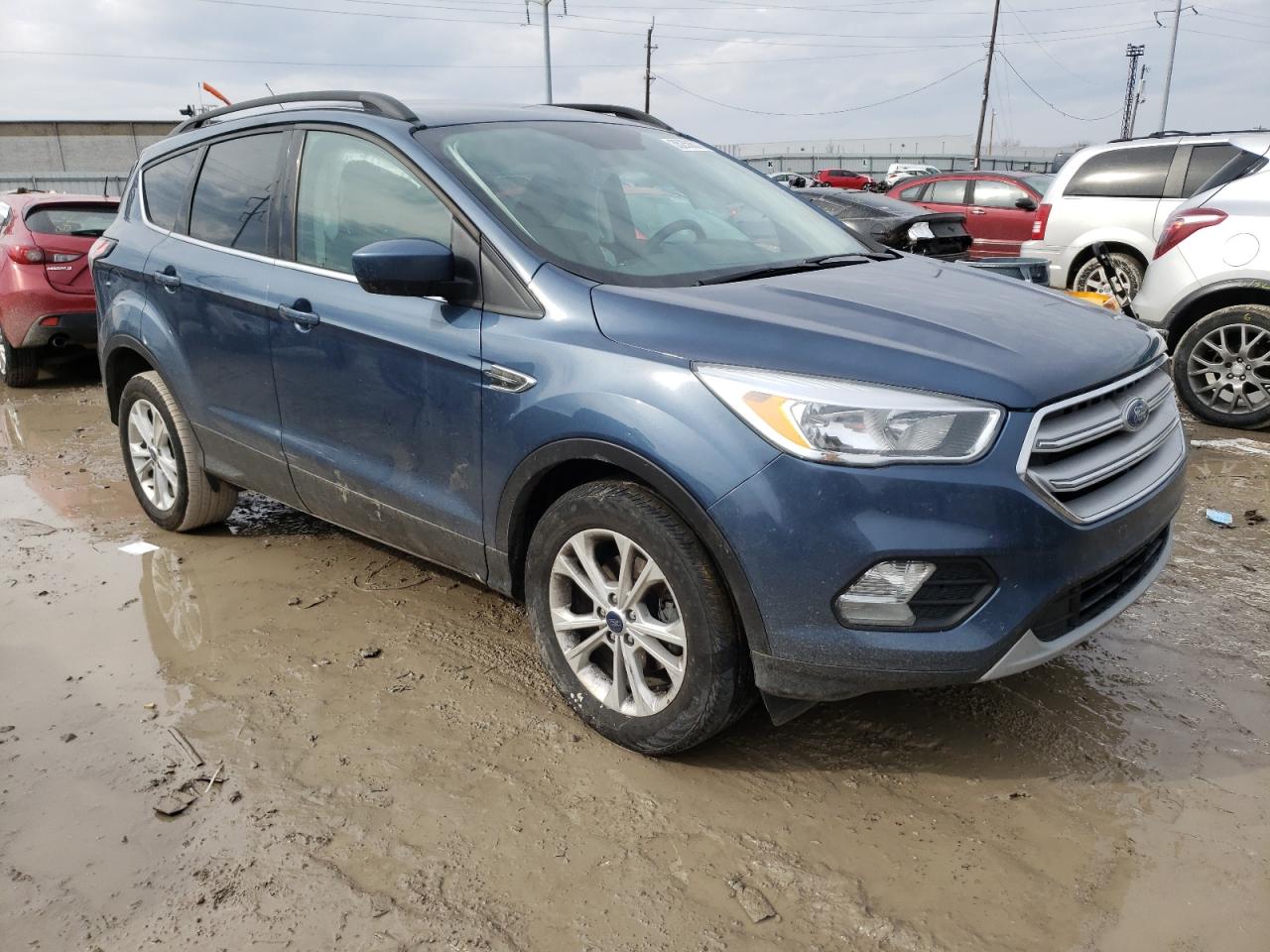 FORD ESCAPE 2018 with VIN 1FMCU0GD9JUA72864 - Photo from auction