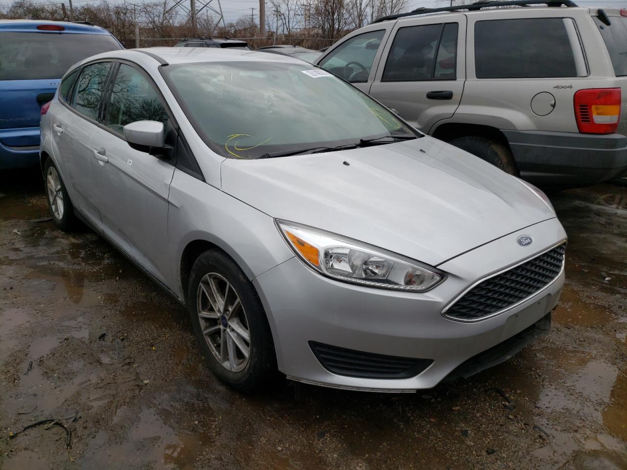 FORD FOCUS SE 2018 with VIN 1FADP3K23JL316625 - Photo from auction