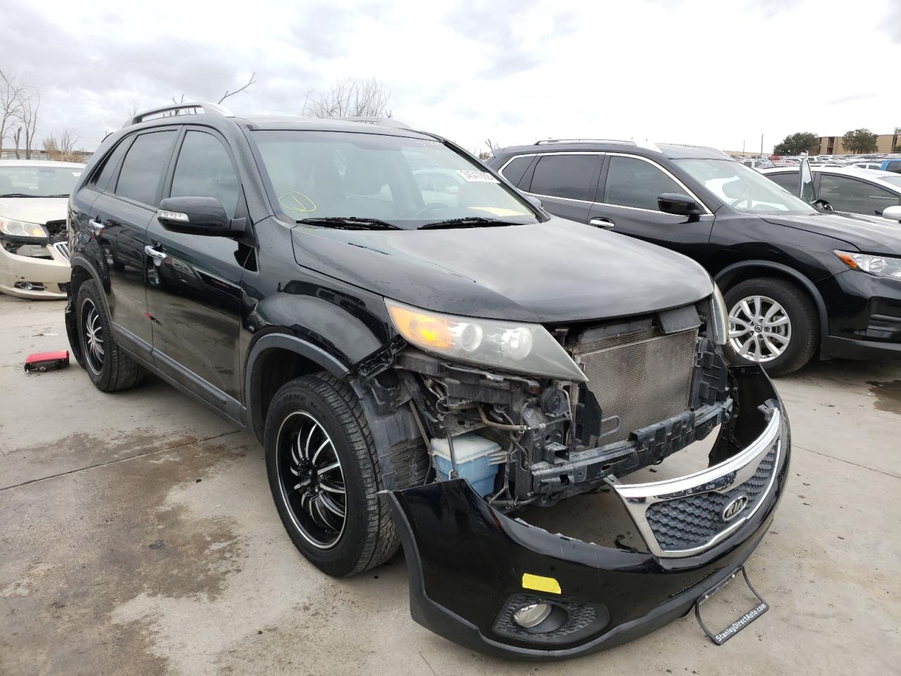 KIA SORENTO EX 2011 with VIN 5XYKU4A26BG077943 - Photo from auction
