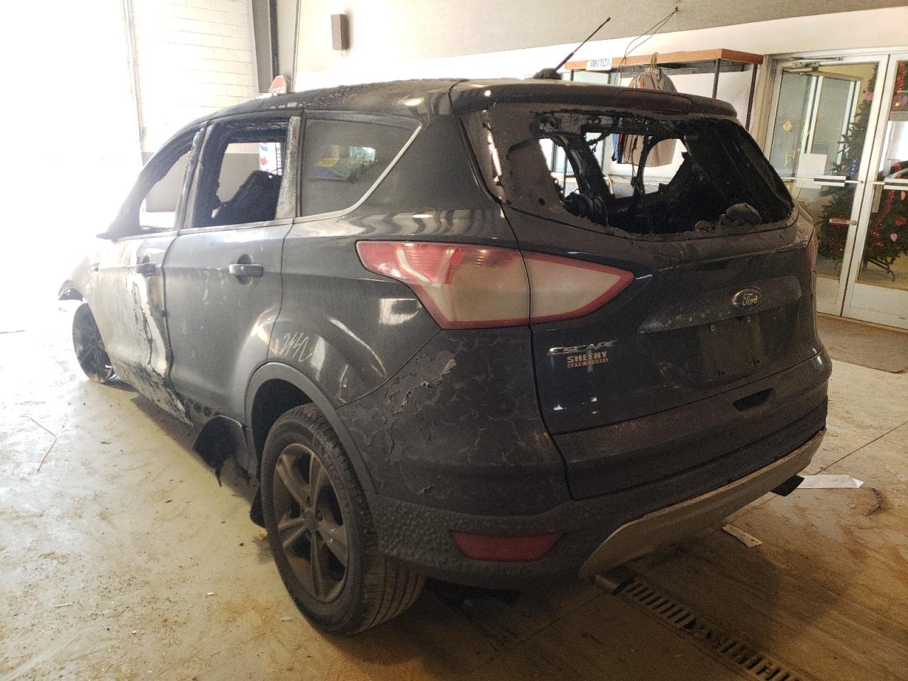 Photo 3 from auction – 2016 FORD ESCAPE SE with VIN 1FMCU0G71GUC36210