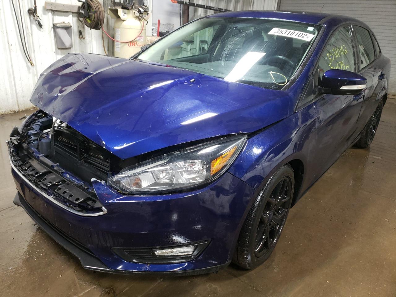 Photo 2 from auction – 2016 FORD FOCUS SE with VIN 1FADP3F24GL299093
