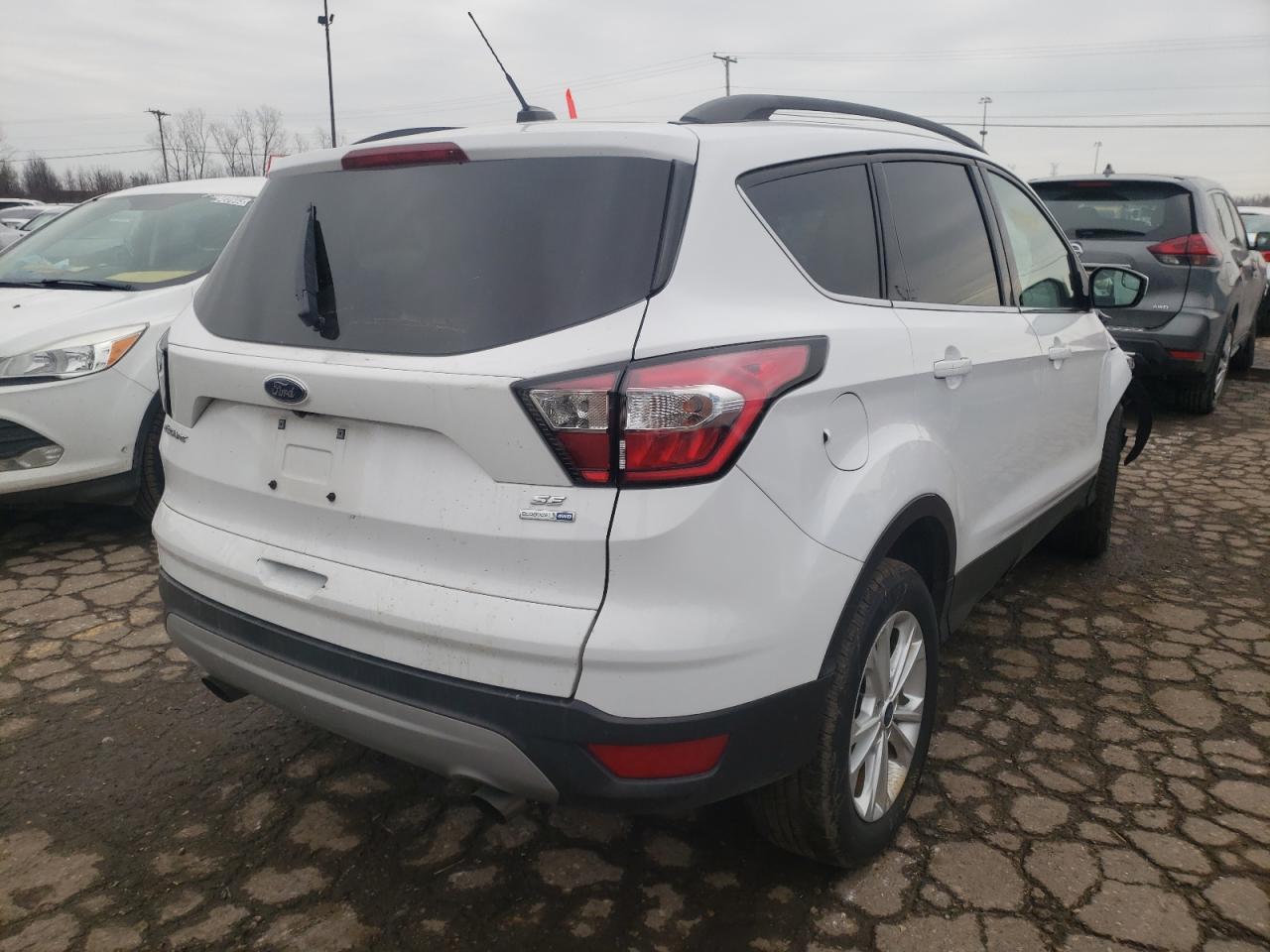 Photo 4 from auction – 2018 FORD ESCAPE SE with VIN 1FMCU9G98JUC63384