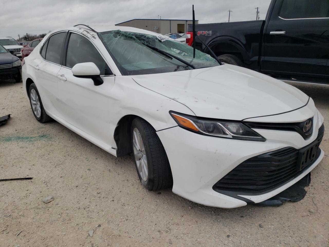 TOYOTA CAMRY LE 2020 with VIN 4T1C11AK2LU320087 - Photo from auction