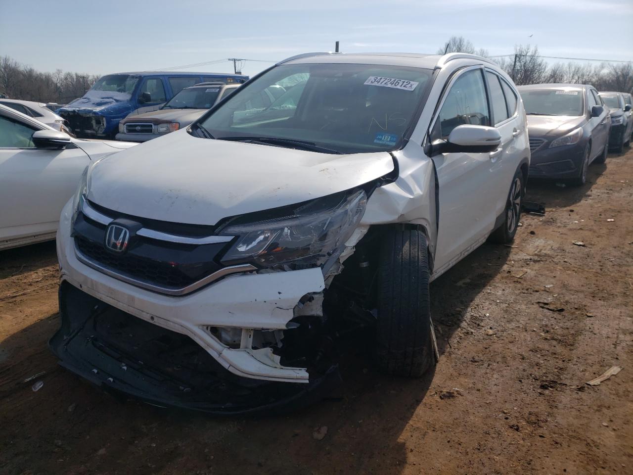 Photo 2 from auction – 2016 HONDA CR-V TOURI with VIN 5J6RM4H99GL011698