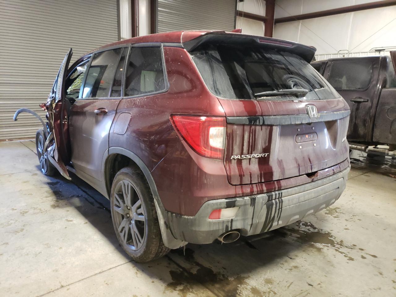 Photo 3 from auction – 2021 HONDA PASSPORT E with VIN 5FNYF8H56MB042549
