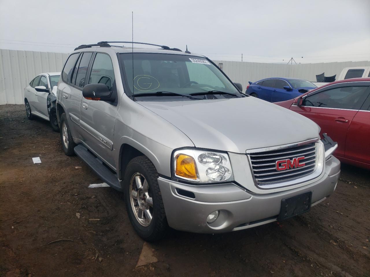 GMC ENVOY 2004 with VIN 1GKDT13S042189985 - Photo from auction