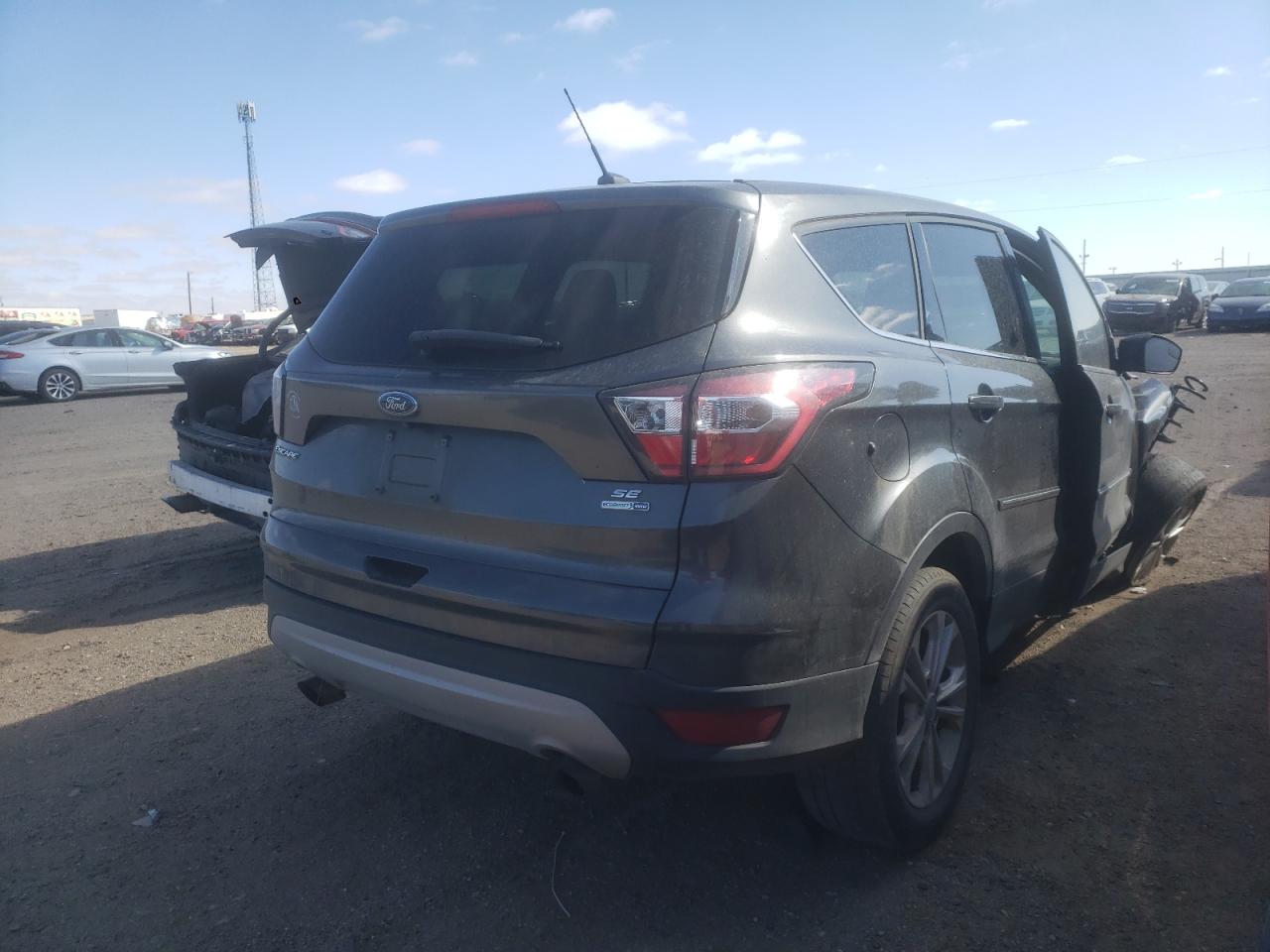 Photo 4 from auction – 2017 FORD ESCAPE SE with VIN 1FMCU9GD6HUB52931