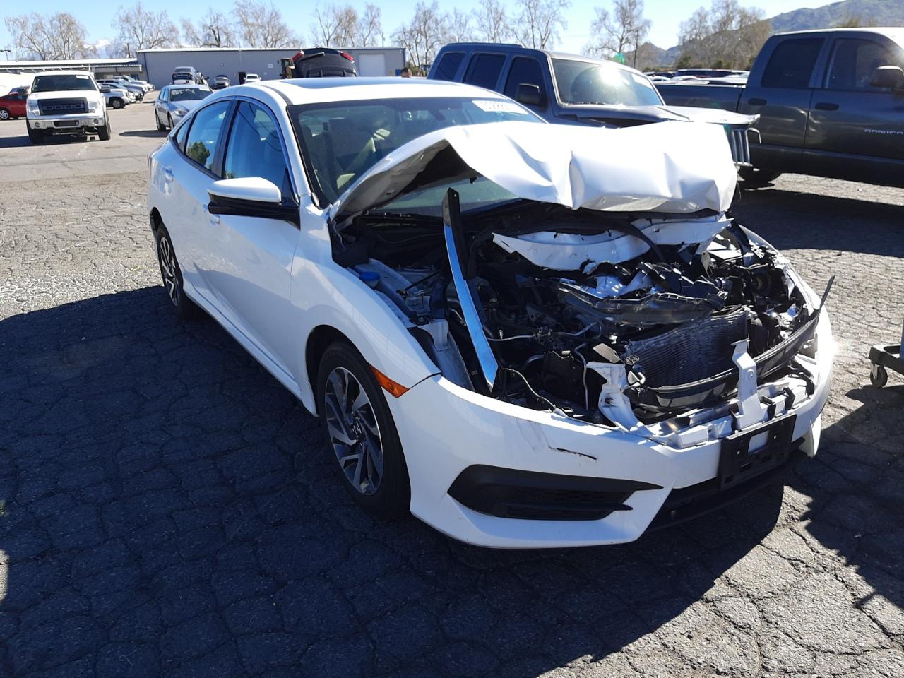 HONDA CIVIC EX 2018 with VIN 19XFC2F76JE207020 - Photo from auction