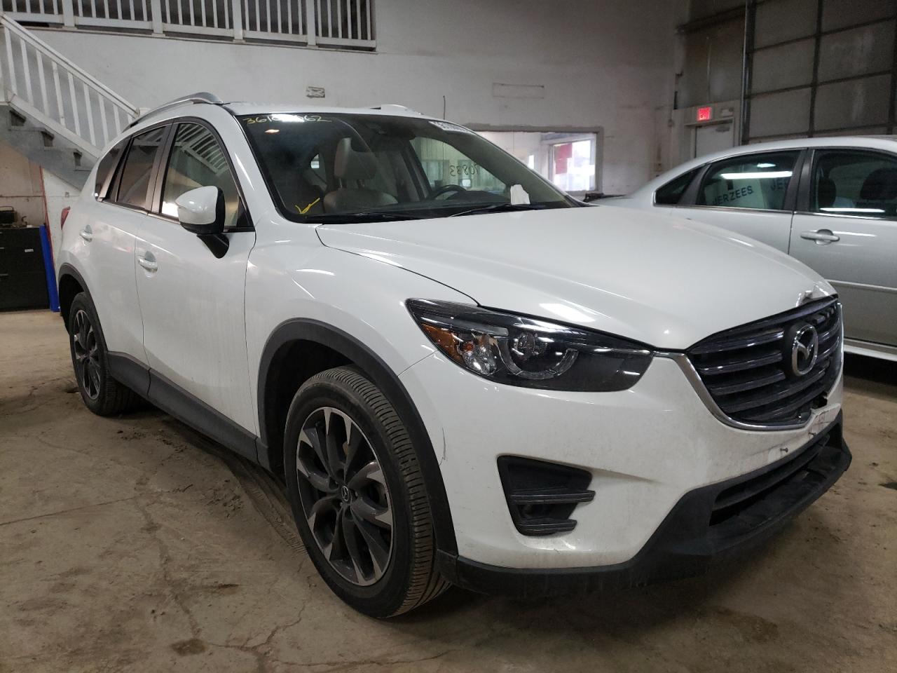 MAZDA CX-5 GT 2016 with VIN JM3KE4DYXG0642809 - Photo from auction