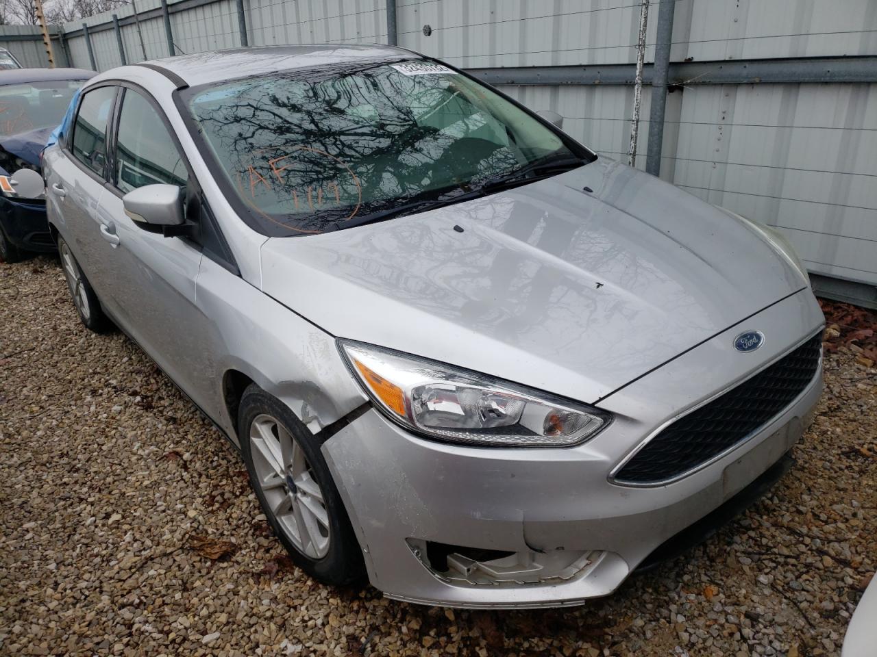 FORD FOCUS SE 2017 with VIN 1FADP3F28HL276711 - Photo from auction
