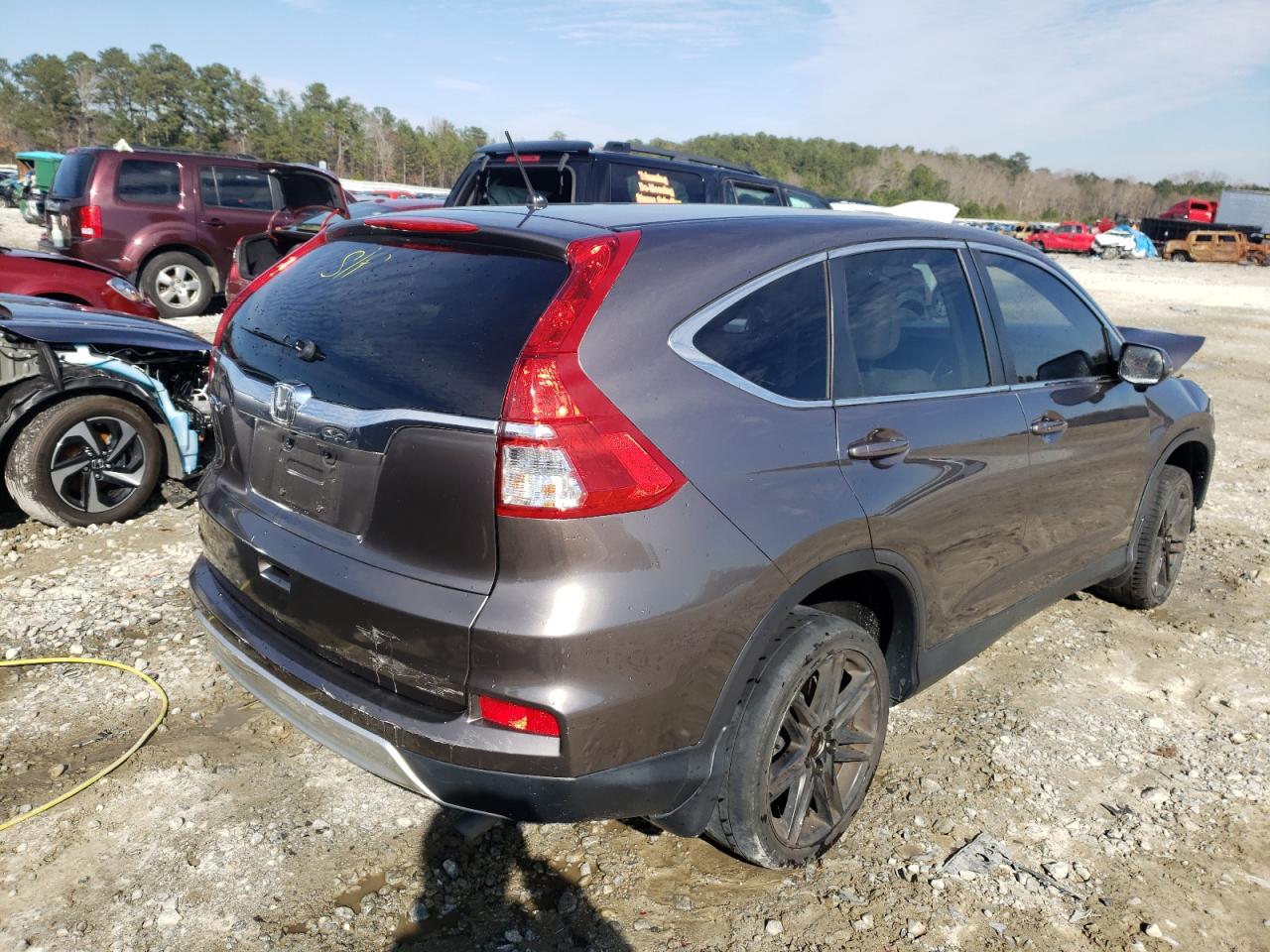 Photo 4 from auction – 2015 HONDA CR-V EX with VIN 3CZRM3H52FG704874
