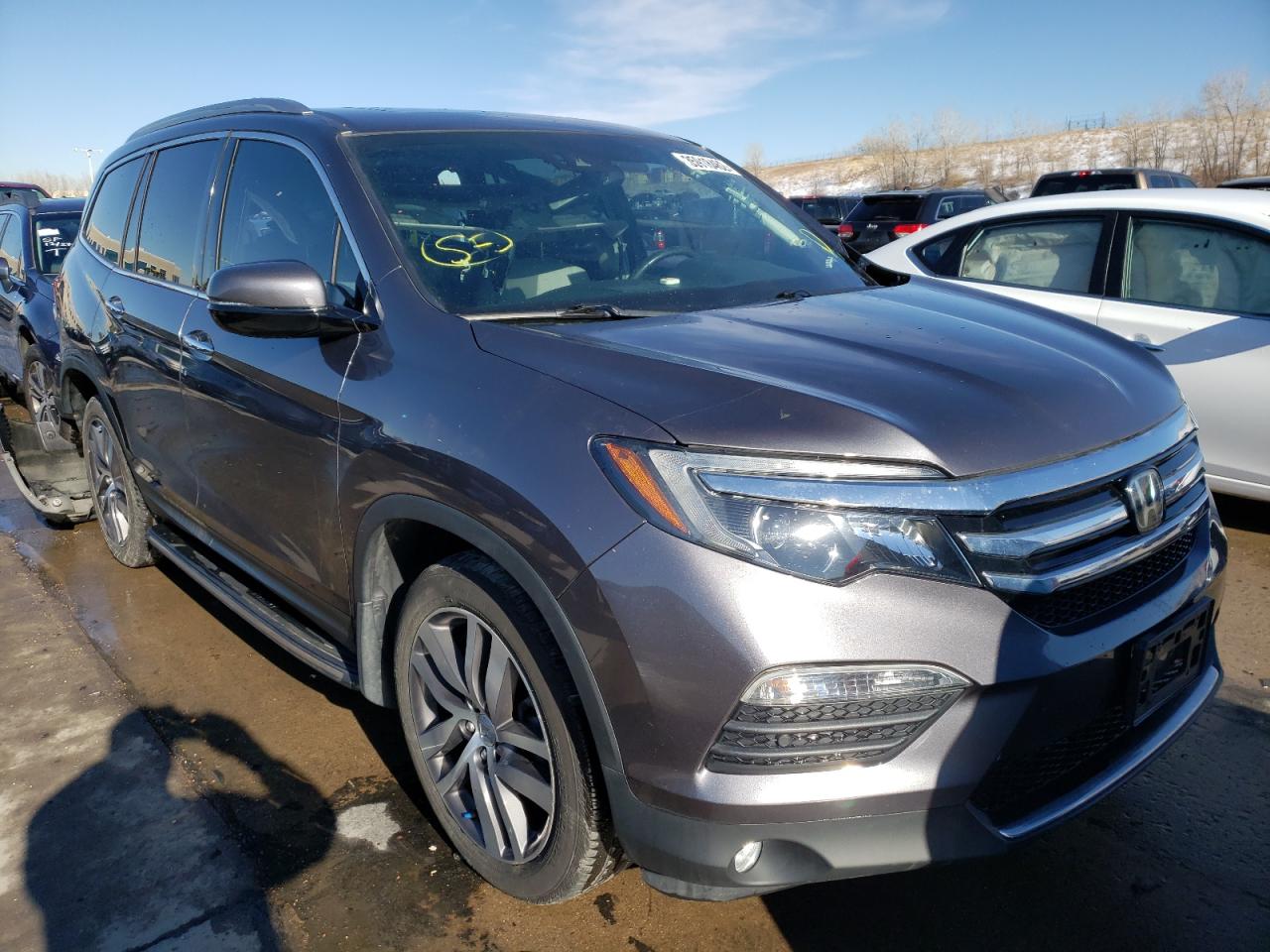HONDA PILOT ELIT 2017 with VIN 5FNYF6H00HB068434 - Photo from auction