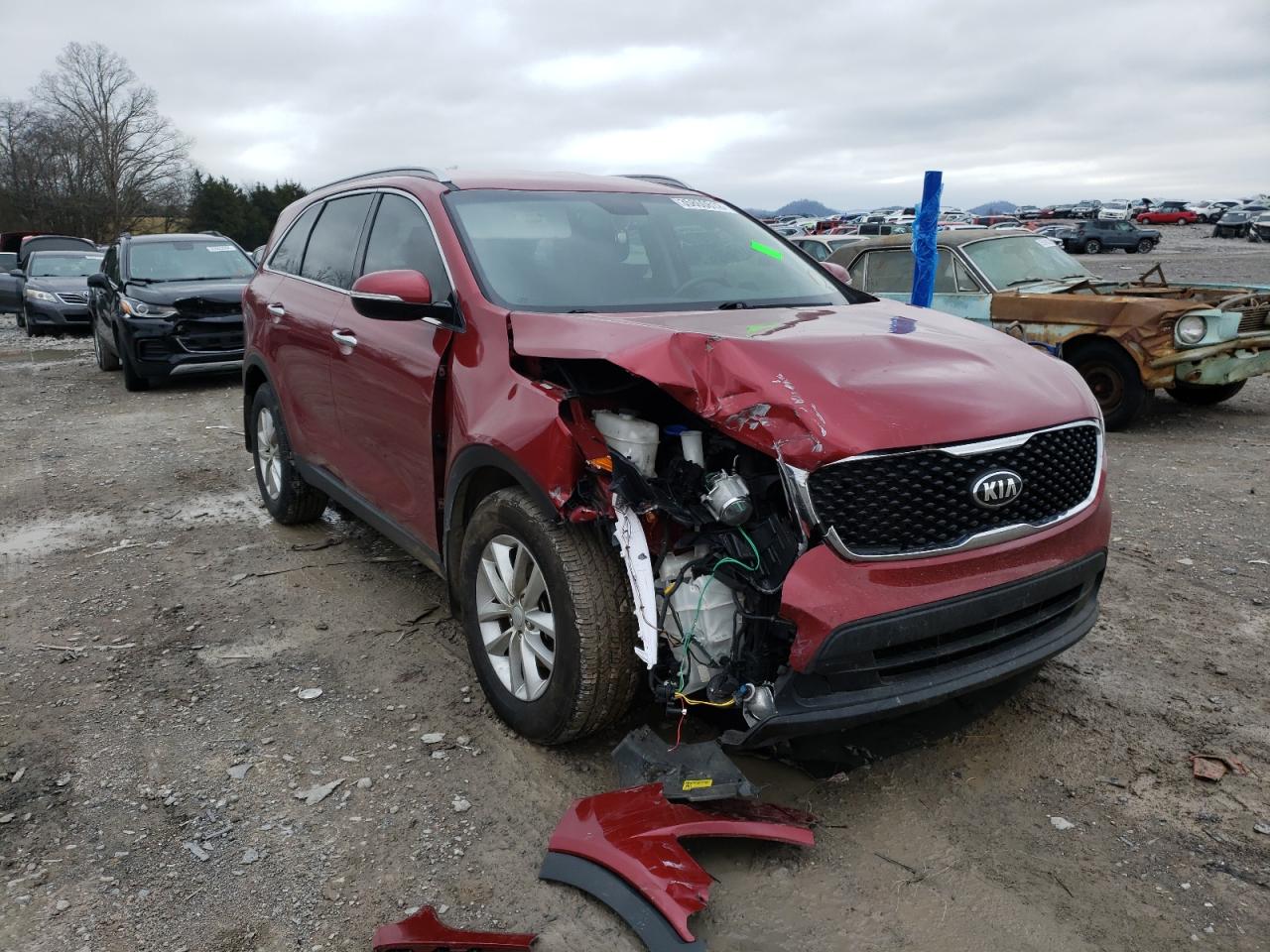 KIA SORENTO LX 2016 with VIN 5XYPG4A35GG157893 - Photo from auction