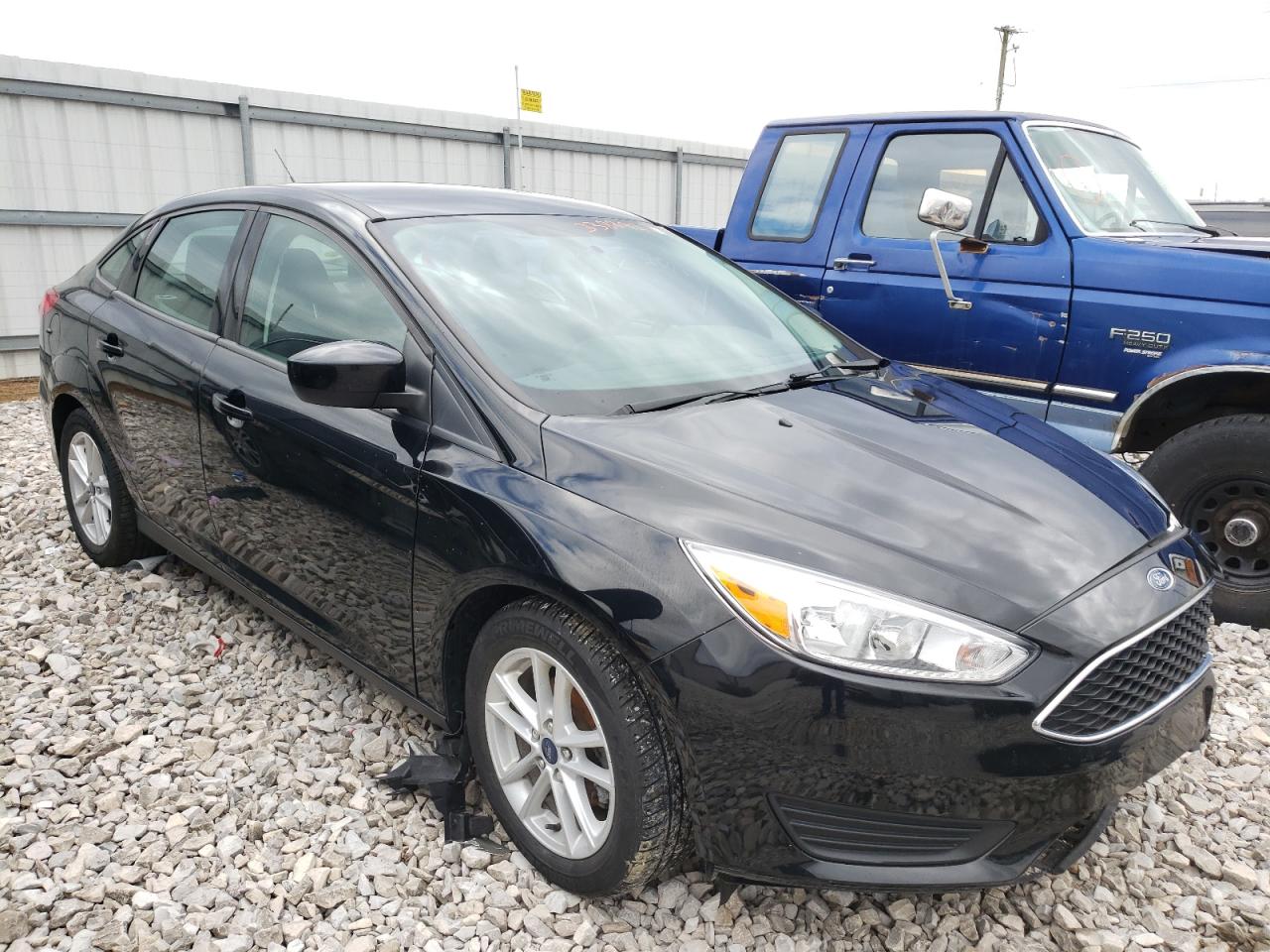 FORD FOCUS SE 2018 with VIN 1FADP3F23JL206765 - Photo from auction