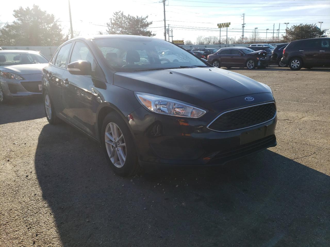 FORD FOCUS SE 2017 with VIN 1FADP3F23HL346860 - Photo from auction