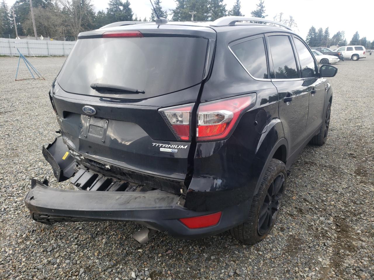 Photo 4 from auction – 2017 FORD ESCAPE TIT with VIN 1FMCU9J98HUB21961