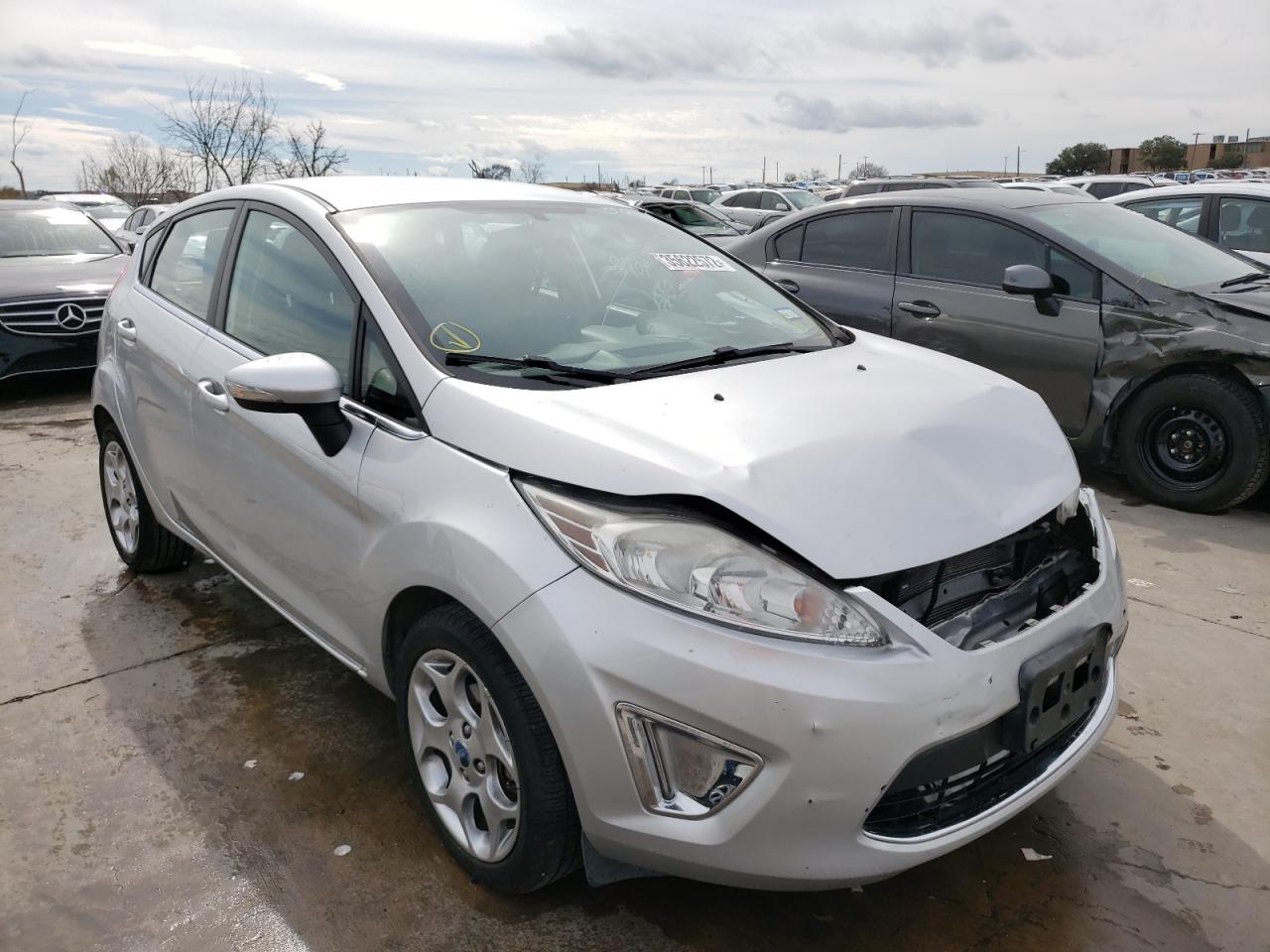 FORD FIESTA SES 2011 with VIN 3FADP4FJ8BM167250 - Photo from auction