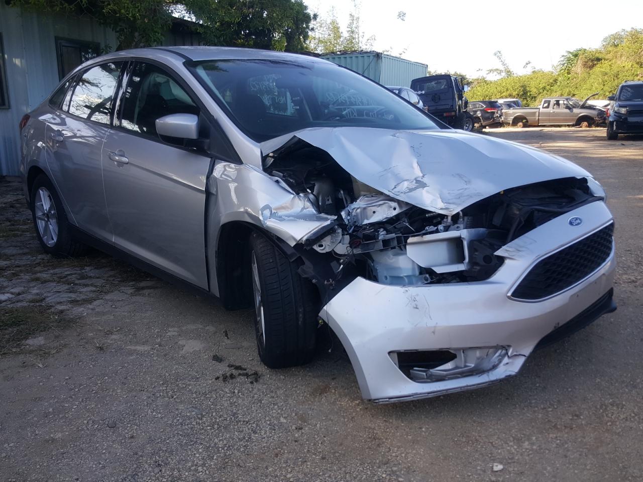 FORD FOCUS SE 2018 with VIN 1FADP3F25JL304910 - Photo from auction