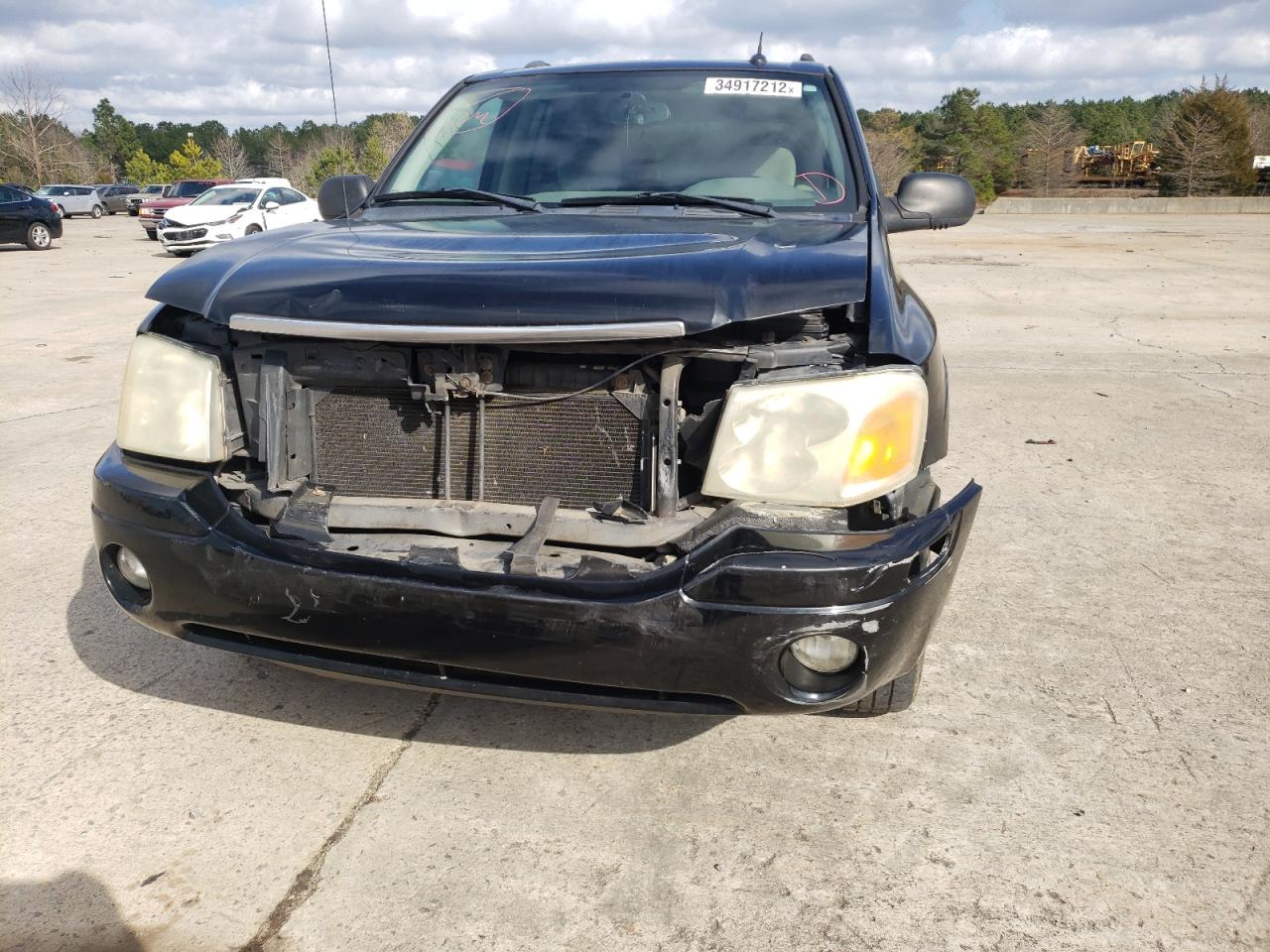 Photo 9 from auction – 2005 GMC ENVOY with VIN 1GKDS13S552114851