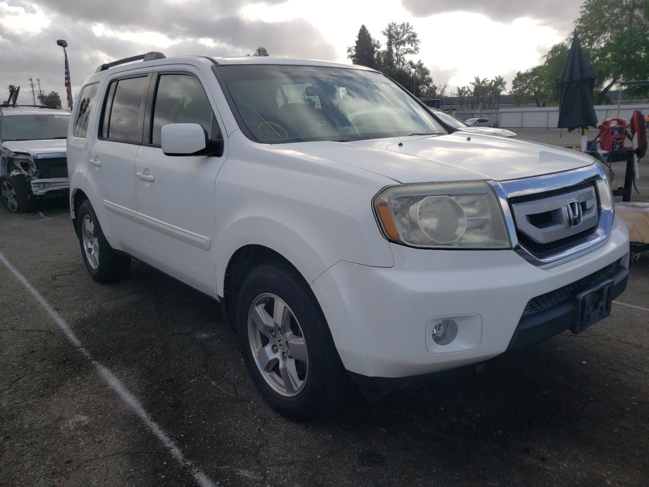 HONDA PILOT EX 2011 with VIN 5FNYF3H4XBB039757 - Photo from auction