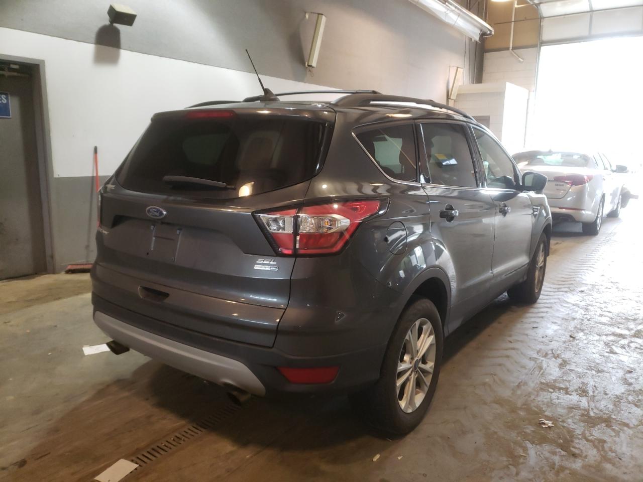 Photo 4 from auction – 2018 FORD ESCAPE SEL with VIN 1FMCU9HD9JUD12319