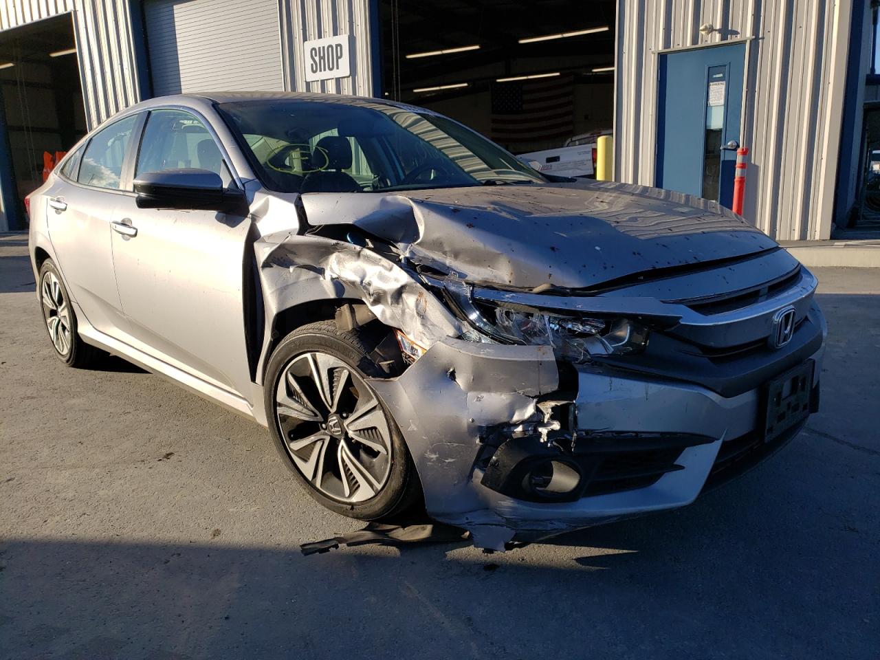 HONDA CIVIC EXL 2016 with VIN 2HGFC1F74GH638254 - Photo from auction