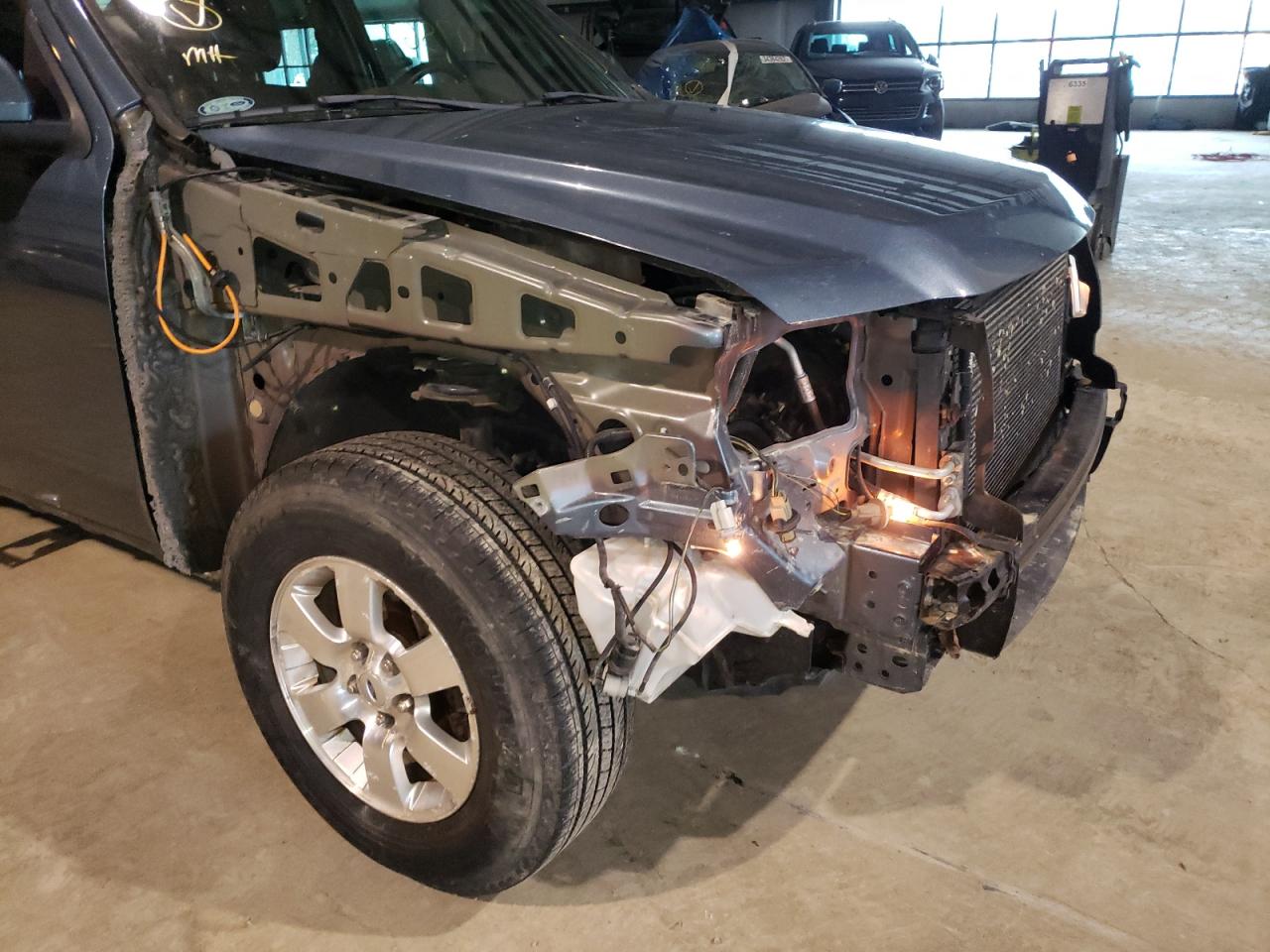 Photo 9 from auction – 2011 FORD ESCAPE LIM with VIN 1FMCU9EG8BKB79323